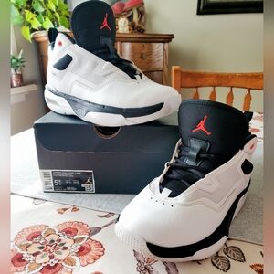 Air Jordan Stay Loyal 3 shoes in the white, black, and red colorway.